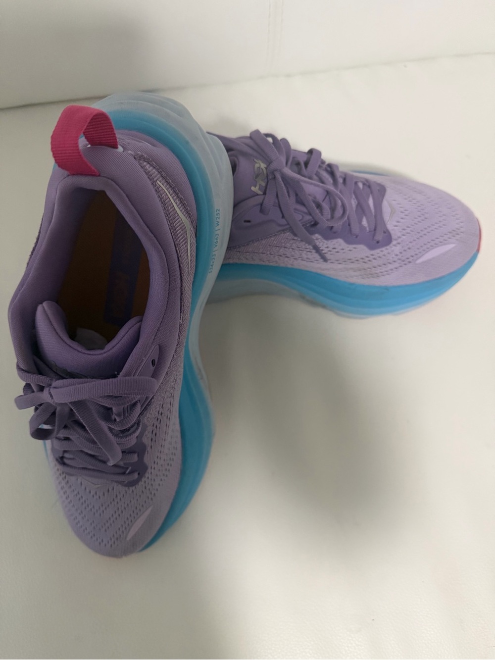 Hoka Lavender Athletic Running Shoes with Blue Midsole and Pink Heel Tab